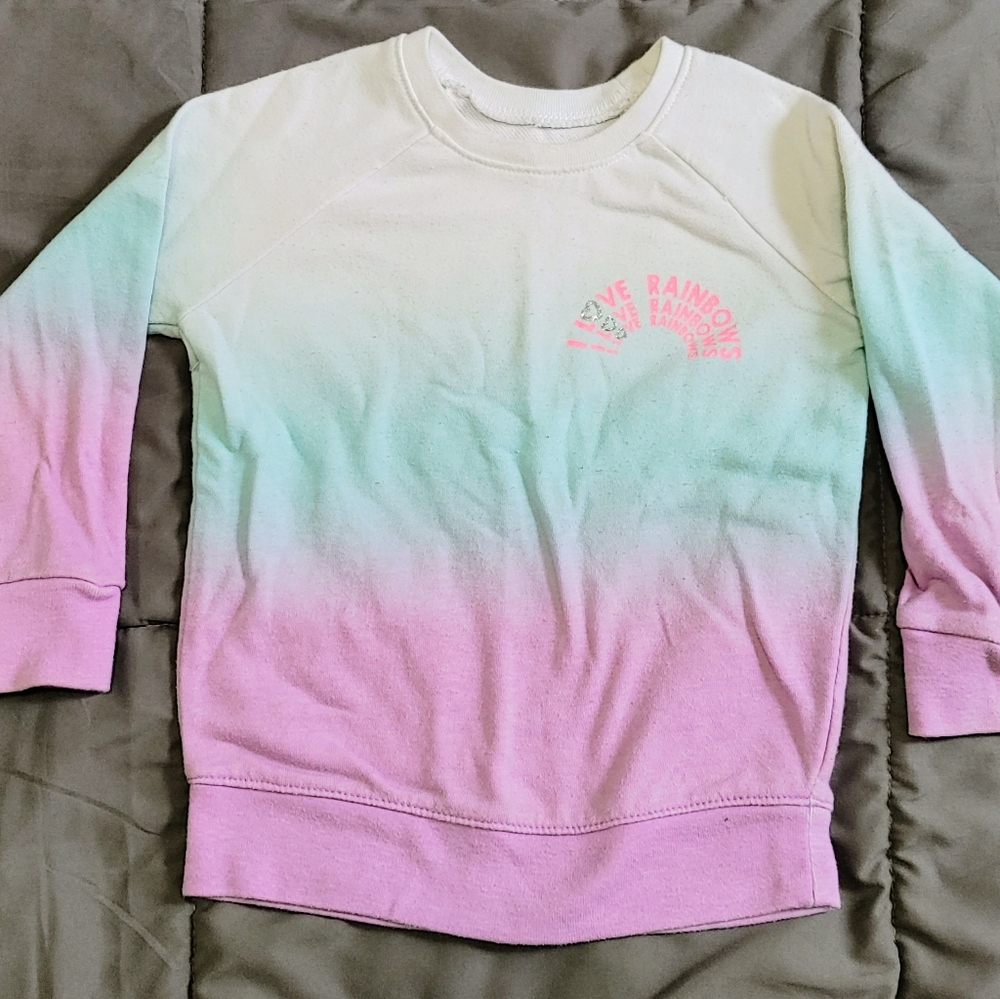 White blue and lavender sweatshirt with "I love rainbows" design